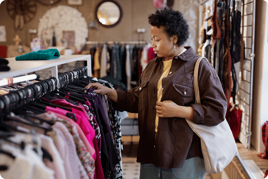 Customer browsing clothing rack